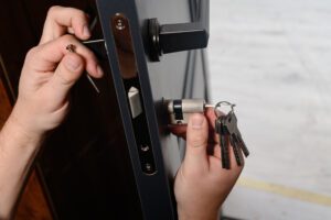 Locksmith installing the cylinder in a door lock